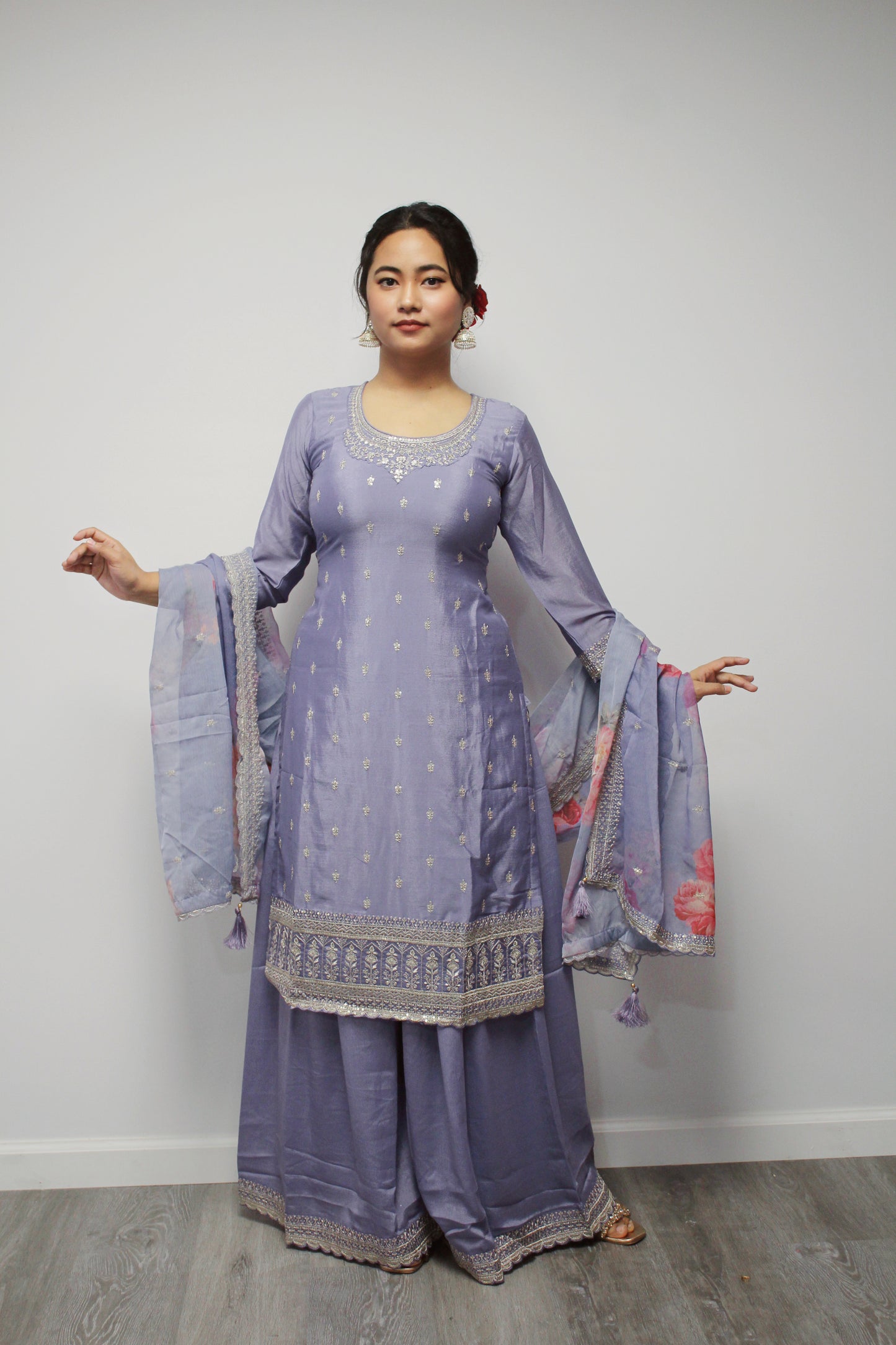 Lavender Sharara set with floral dupatta.